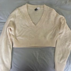 Cream colored crop top college style shirt